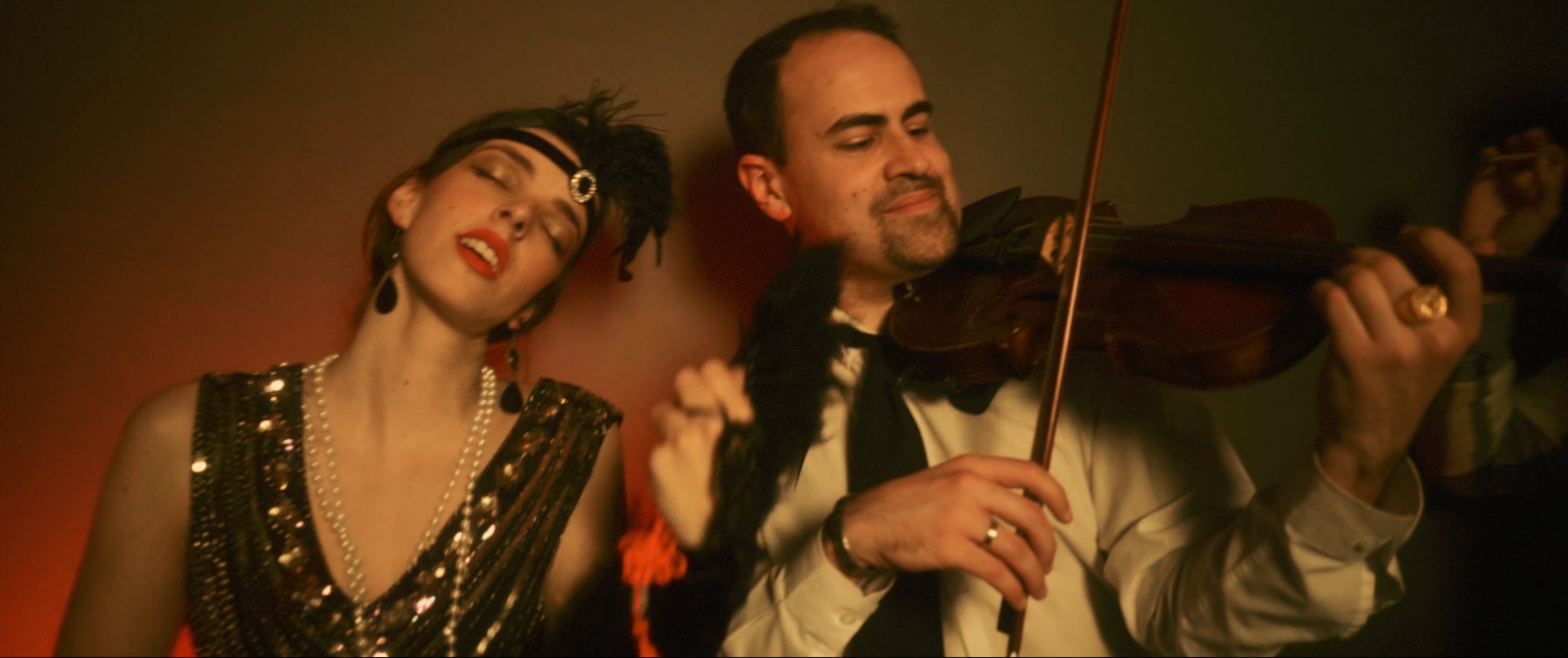 E. Sousa playing violin alongside actress Marta Oliveira Pinto during the production of Rafael Xavier's music video Orion, Guide Me